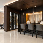 Custom wood-paneled wine wall and bar millwork | Sunshine Alliance, Boca Raton FL