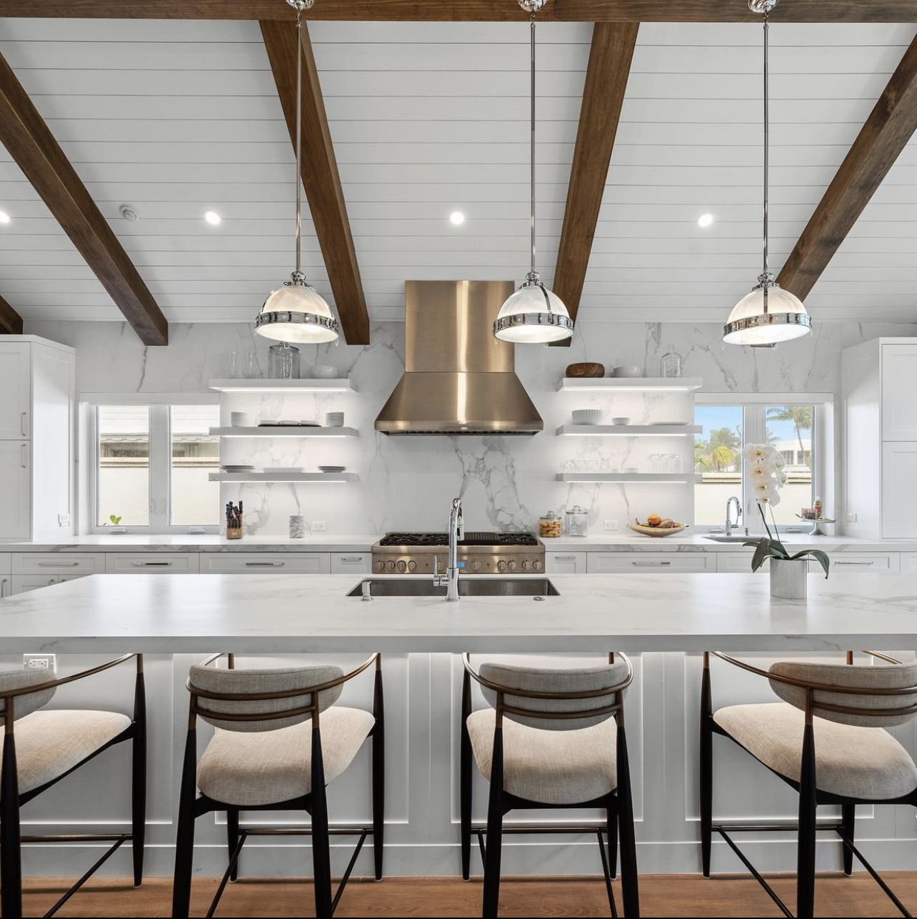 Vaulted-beam white kitchen with island | Sunshine Alliance, Boca Raton FL