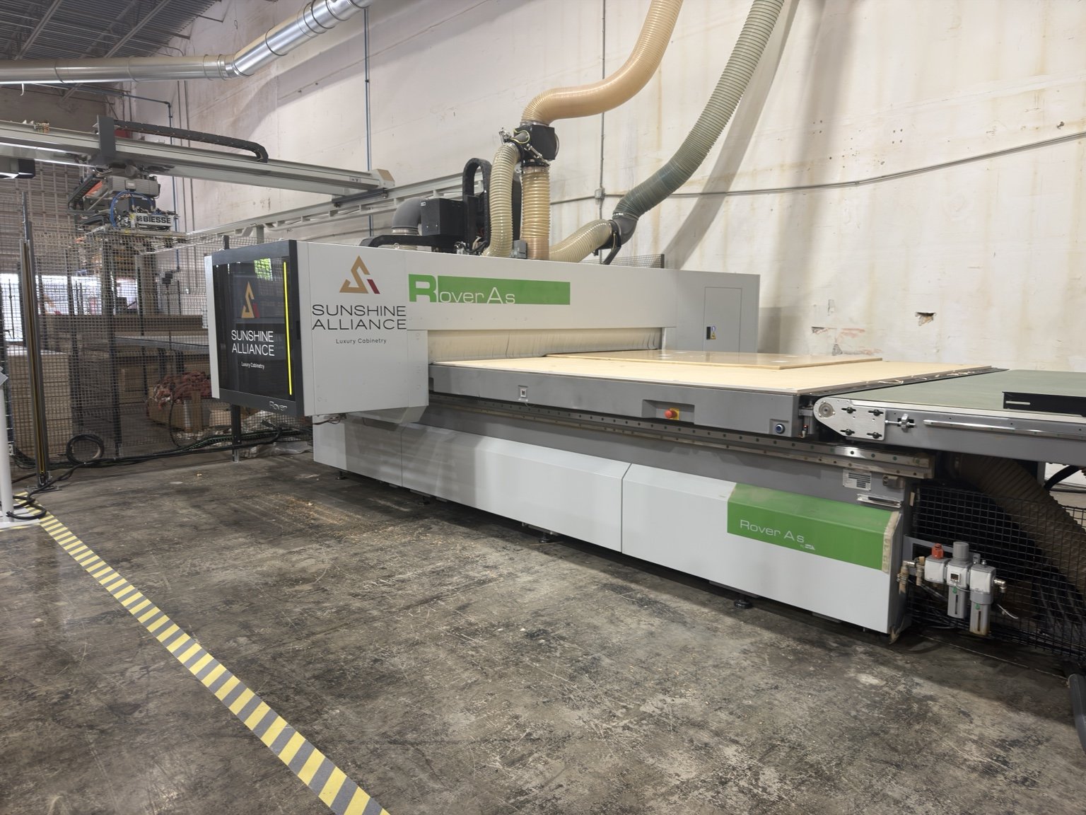 A full sheet loaded on our Biesse CNC mid-run, the busy floor that tells you a shop actually has work | Sunshine Alliance, Deerfield Beach FL