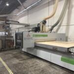 Biesse Rover A CNC router with a panel loaded on the vacuum table, branded Sunshine Alliance guard | Sunshine Alliance, Deerfield Beach FL