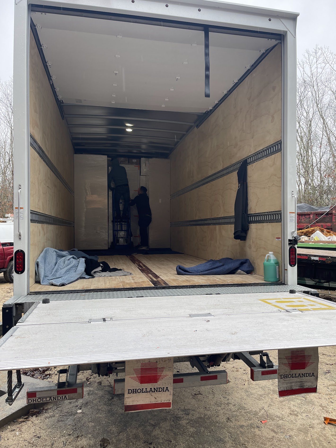 The Sunshine Alliance crew unloading custom cabinetry from the truck at a Hamptons job site | Sunshine Alliance, Hamptons NY