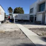 Two Sunshine Alliance box trucks delivering custom cabinetry to a home under construction | Sunshine Alliance, South Florida