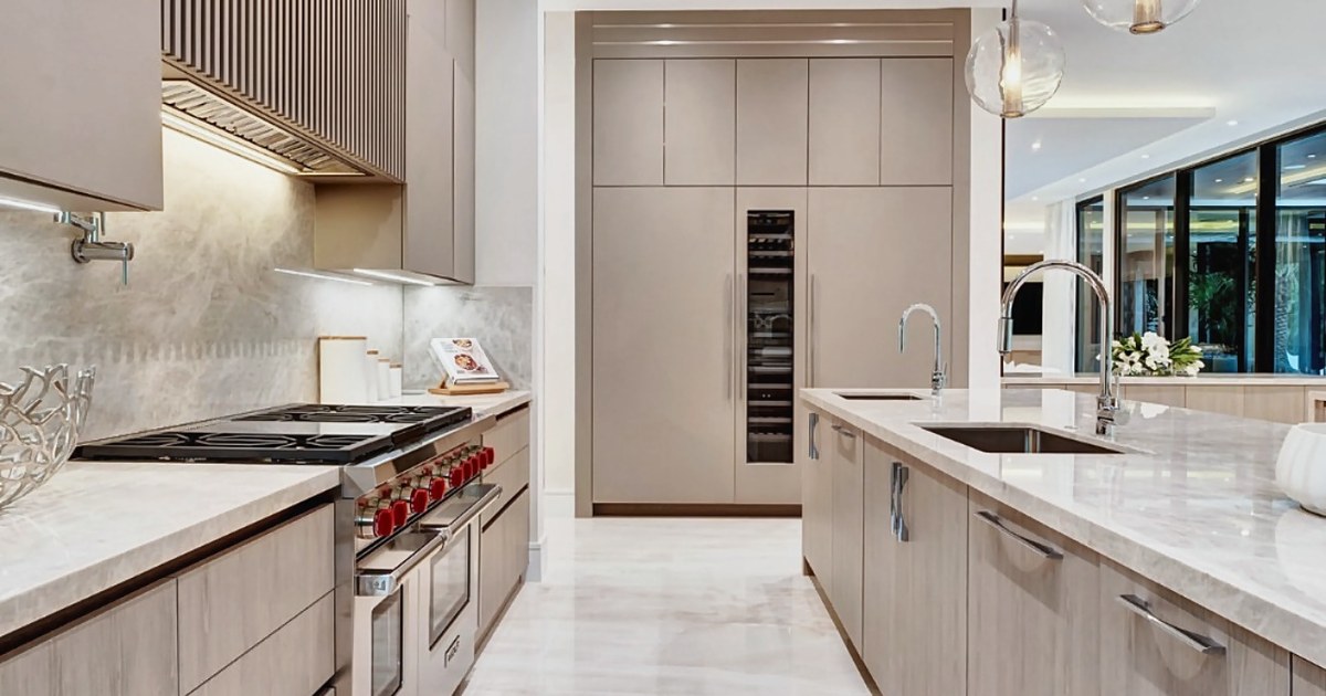 Flush-build integrated kitchen appliances reading as one continuous run of cabinetry, Sunshine Alliance custom cabinets Deerfield Beach Florida.