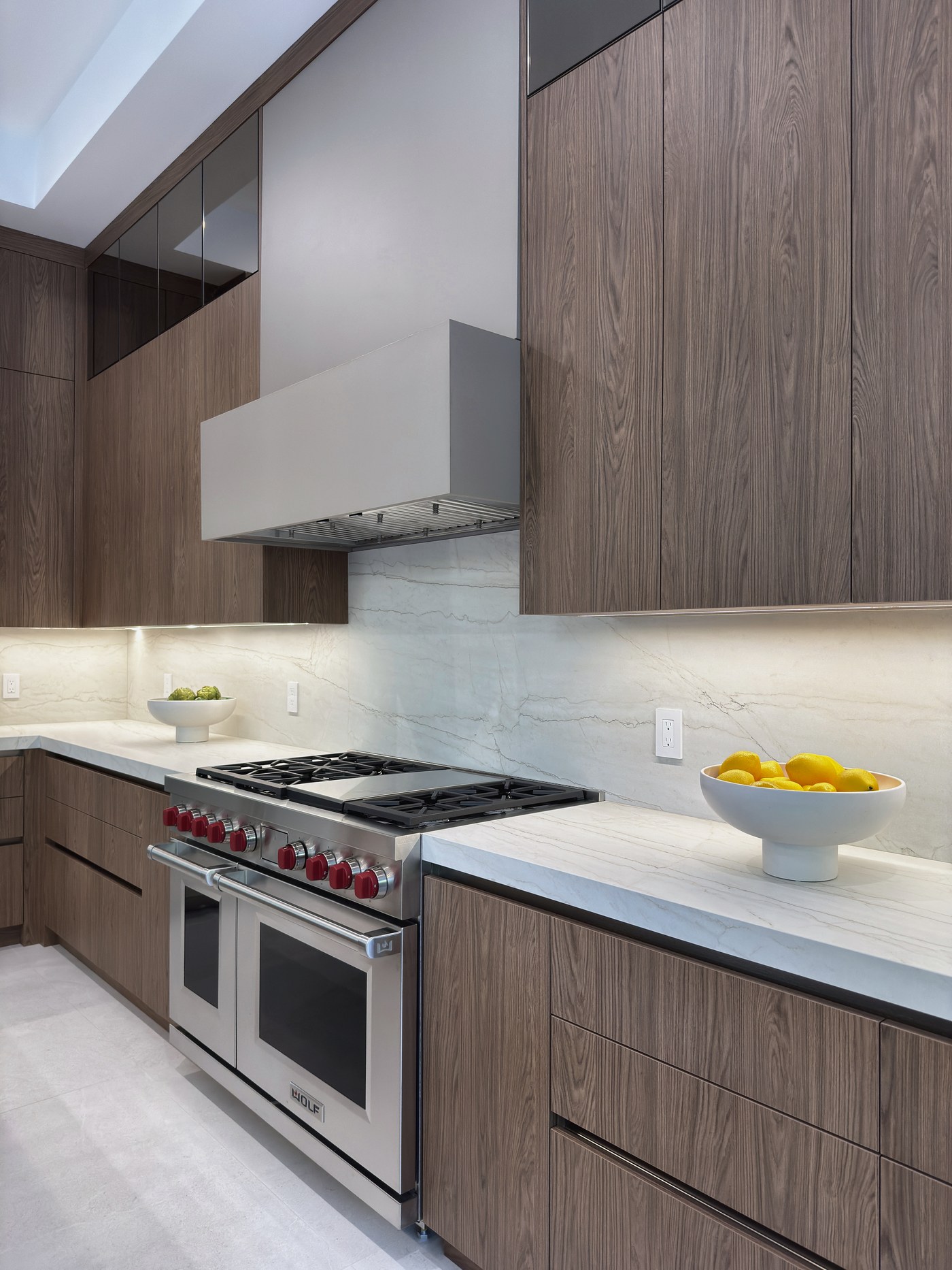 Custom canopy hood integrated into cabinetry above the range, Sunshine Alliance millwork, South Florida.