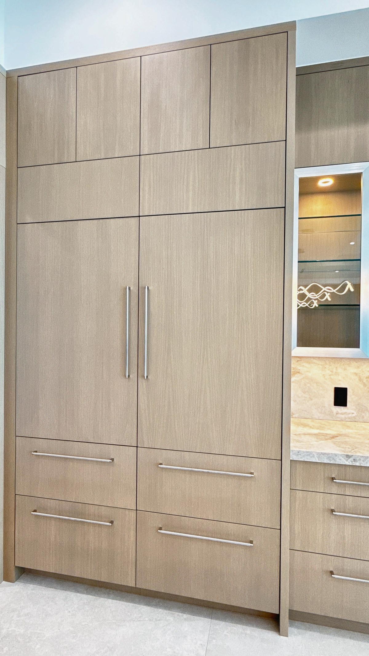 Panel-ready refrigerator sitting flush with custom cabinetry, Sunshine Alliance precision integration, Deerfield Beach.